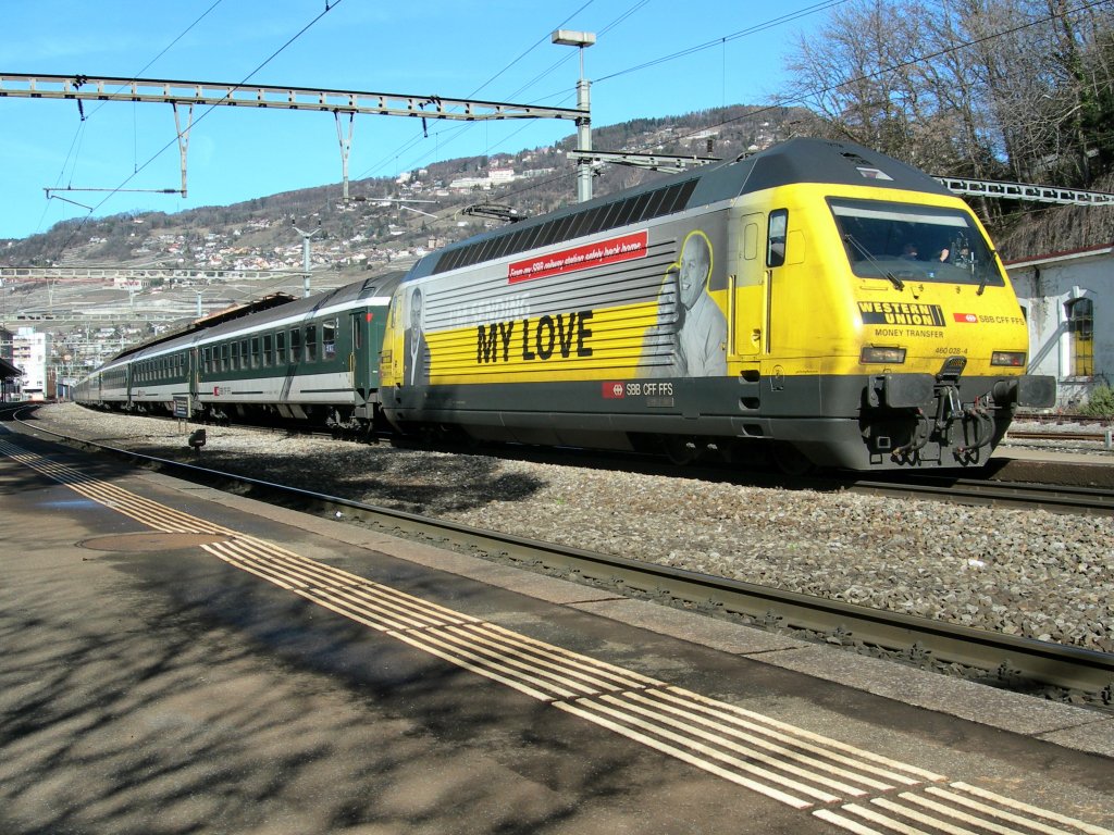 Die Re 460 028-4  Westernunion  mit IR nach Brig in Vevey am 27. Februar 2010.