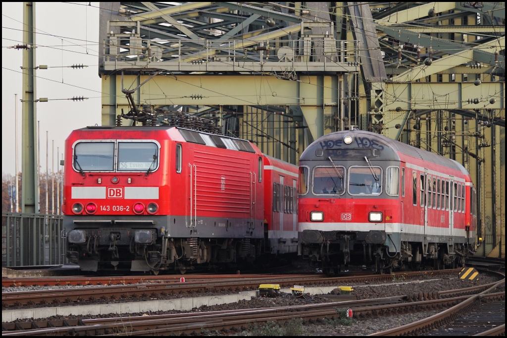 Nahverkehr der  alten Art  143 036 mit X-Wagen als S-Bahn, und eine 111 mit N-Wagen als Regionalzug. (Kln,19.11.11)