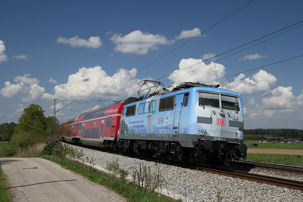 Olympialok 111-031 mit Regio bei Weiching auf der Fahrt von Mnchen in Richtung Rosenheim am 30. Apr. 2011.