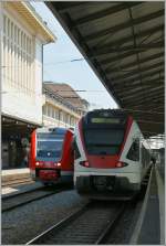 Zwei moderne, aber doch ganz verschiedene  Gesichter : SBB Flirt RABe 523 014 und DB 612 501 in Lausanne. 

30. Mai 2012.
