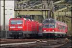 Nahverkehr der  alten Art  143 036 mit X-Wagen als S-Bahn, und eine 111 mit N-Wagen als Regionalzug. (Kln,19.11.11)