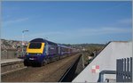 Ein HST 125 Class 43 Zug als GWR Service 0541 von Penzance nach London Paddington fährt ohne Halt im Bahnhof von Exeter St Thomas vorbei und wird in Kürze den nächsten Halt, Exeter St David erreichen. 
20. April 2016