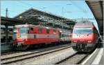 Re 4/4 II 11109 (Swiss Express) und Re 460 015-1 in Lausanne.