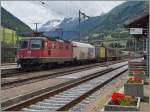 re-420-re-4-4-ii-/457901/die-sbb-re-44-ii-11166 Die SBB RE 4/4 II 11166 mit einem kurzen Güterzug in Airolo. 
(Gotthrad-Südrampe). 
23. Juni 2015