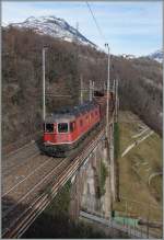 re-620-re-6-6/410078/die-sbb-re-66-11611-mit Die SBB Re 6/6 11611 mit einem Güterzug Richtung Süden bei Preglia.
27. Jan. 2015