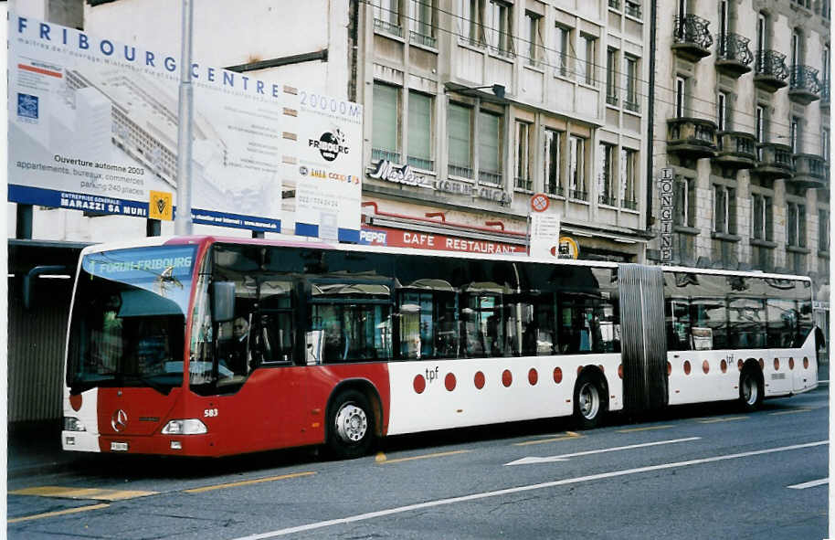 (052'111) - TPF Fribourg - Nr. 583/FR 300'390 - Mercedes am 17. Februar 2002 beim Bahnhof Fribourg