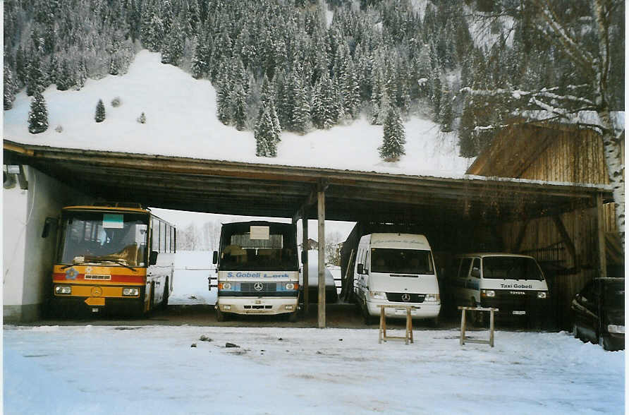 (081'807) - Gobeli, Lenk - Mercedes/Vetter (ex AVG Grindelwald Nr. 16; ex Danzas, Lugano) + Mercedes/Auwrter + Mercedes + BE 75'372 - Toyota am 11. Dezember 2005 in Lenk, Garage