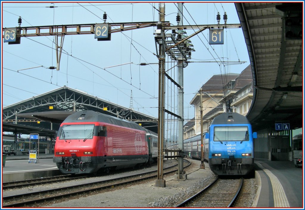 Re 460 063-1 mit einem IR nach Brig und Re 460 076-1 mit einem IC nach St.Gallen am 10. April 2010 in Lausanne.

