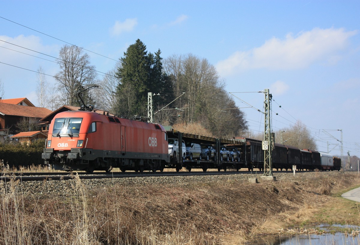 1116 067-0 mit einem kurzen gemischten Güterezug am 22. März 2013 bei Weisham.