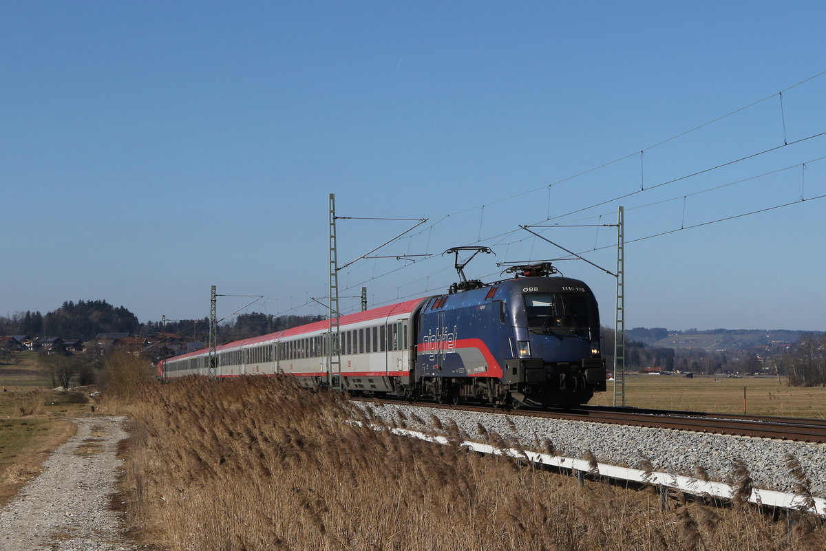 1116 195  Nightjet  war mit dem EC 113 in Richtung Salzburg unterwegs. Aufgenommen am 28. Februar 2021 bei Bernau am Chiemsee.