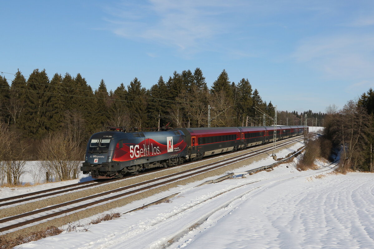 1116 231  5 geht los  auf dem Weg nach Mnchen. Aufgenommen am 24. Januar 2022 bei Grabensttt im Chiemgau.