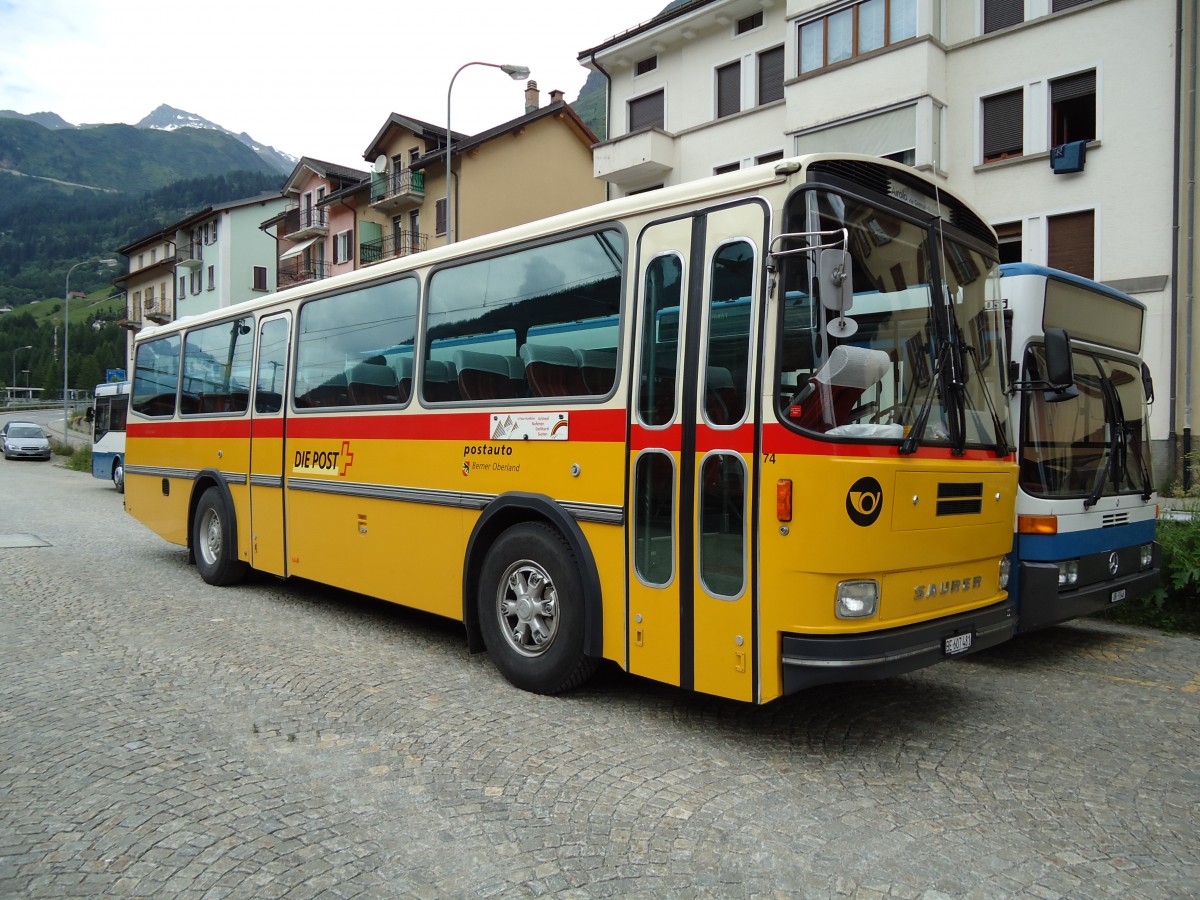 (127'564) - AVG Meiringen - Nr. 74/BE 607'481 - Saurer/R&J (ex P 24'357) am 4. Juli 2010 beim Bahnhof Airolo