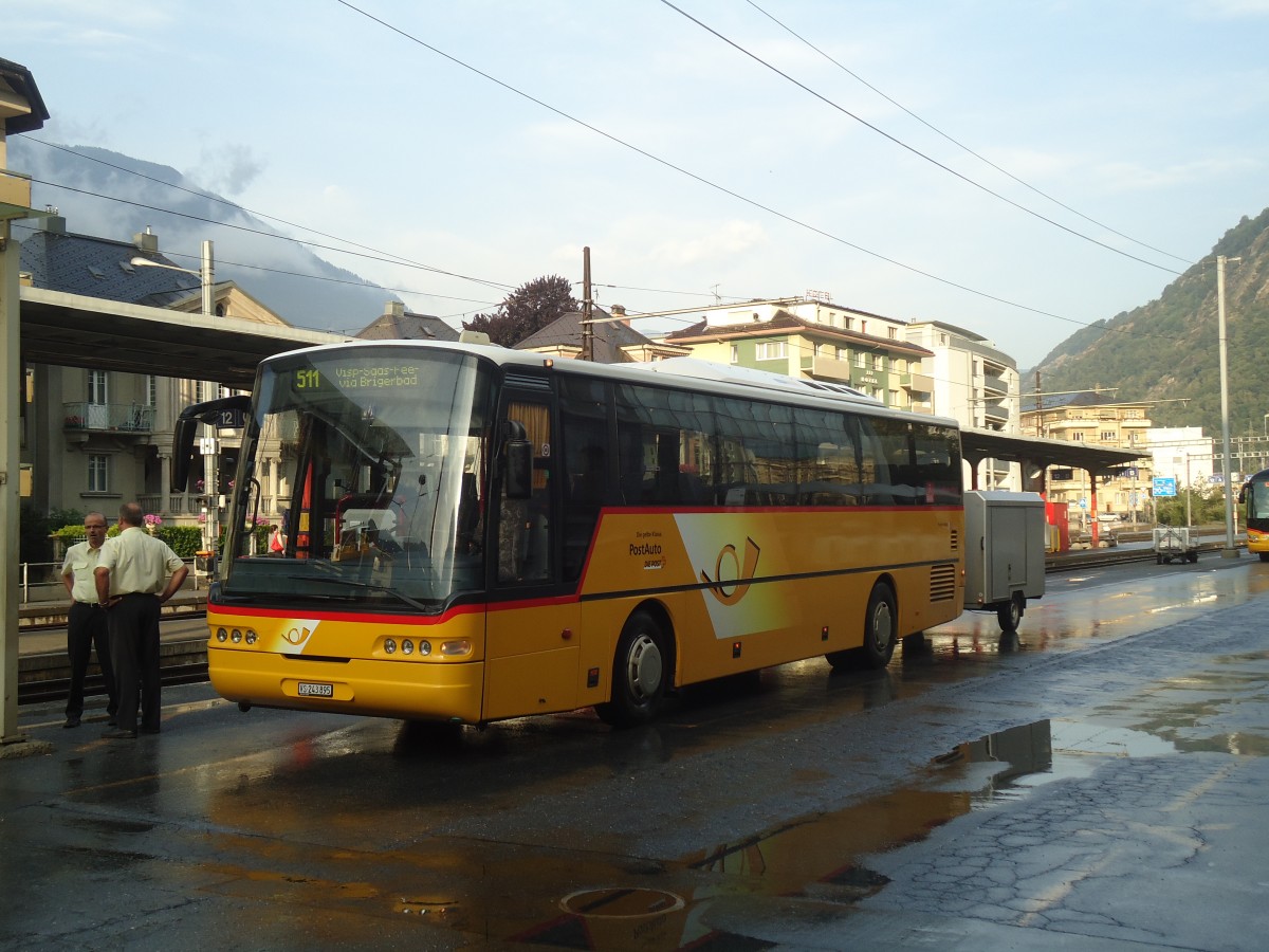 (140'232) - PostAuto Wallis - VS 243'895 - Neoplan (ex P 25'171) am 1. Juli 2012 beim Bahnhof Brig