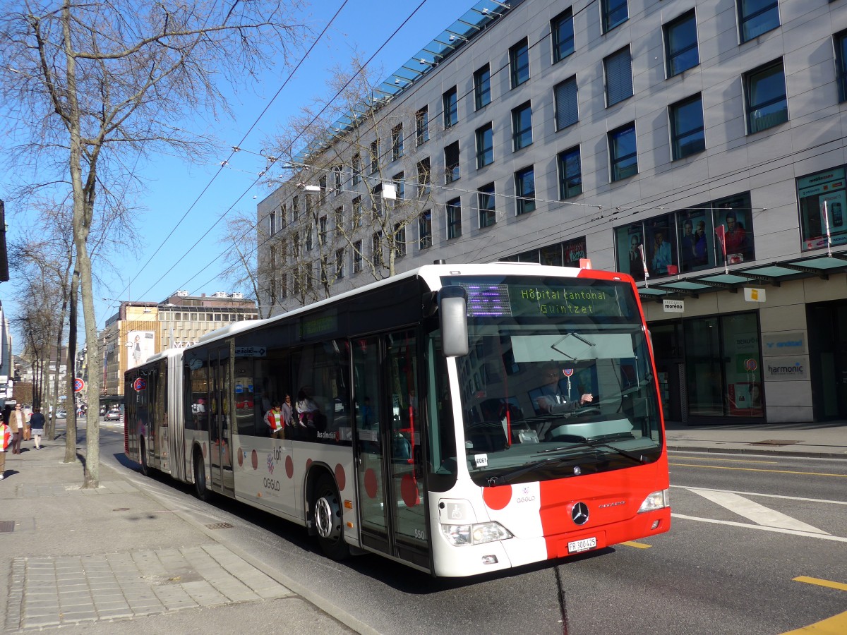 (149'282) - TPF Fribourg - Nr. 550/FR 300'425 - Mercedes am 9. Mrz 2014 beim Bahnhof Fribourg