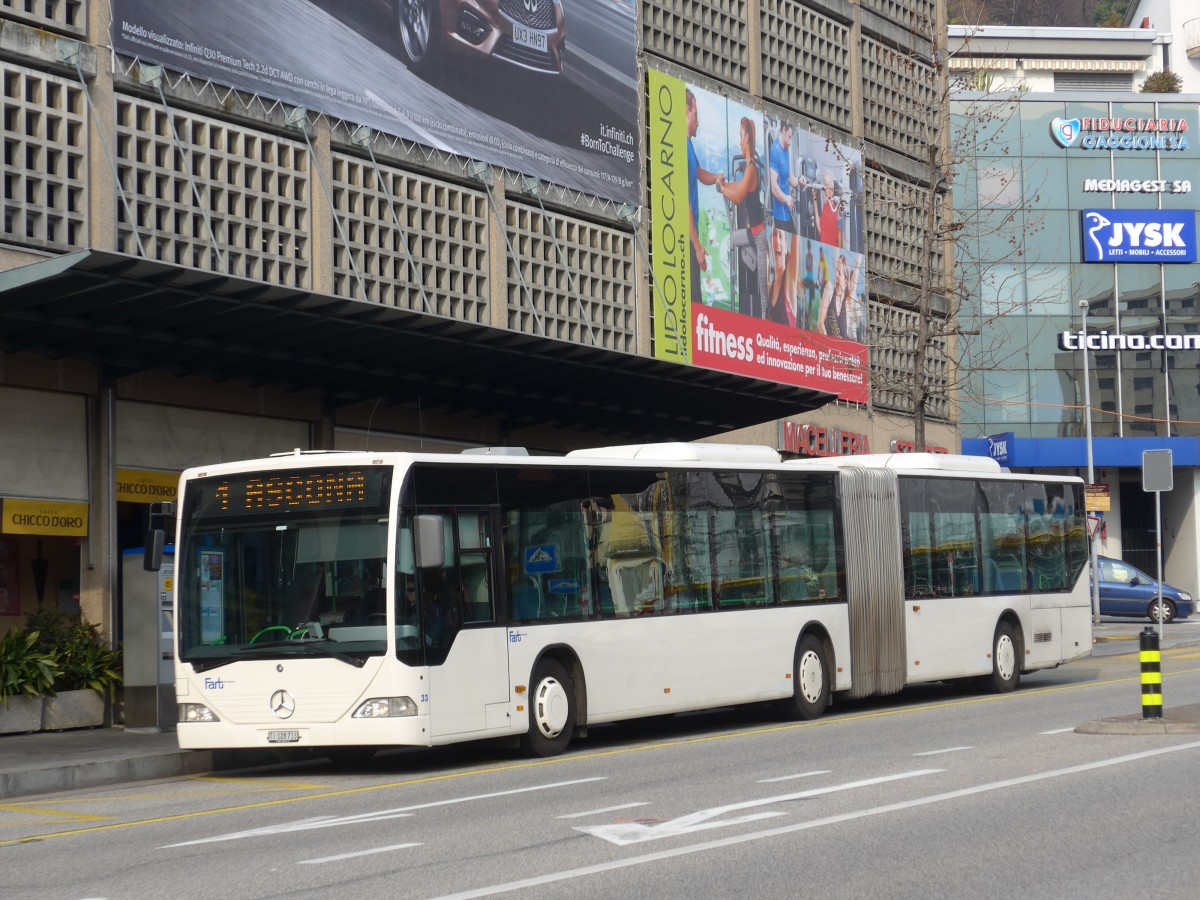 (168'629) - FART Locarno - Nr. 33/TI 128'733 - Mercedes (ex SBC Chur Nr. 92; ex ARL Viganello Nr. 23; ex TPL Lugano Nr. 29) am 6. Februar 2016 beim Bahnhof Locarno