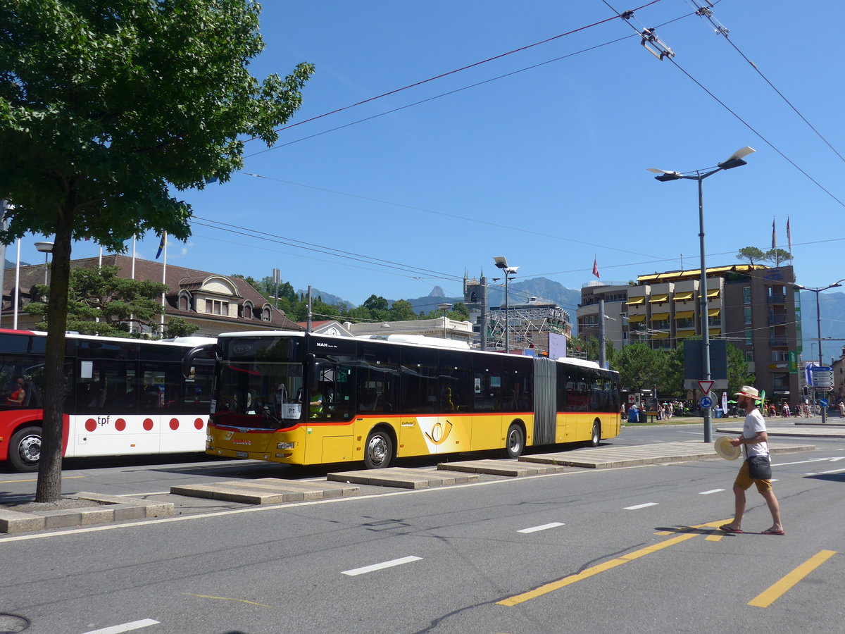 (208'457) - CarPostal Ouest - VD 577'065 - MAN am 4. August 2019 beim Bahnhof Vevey