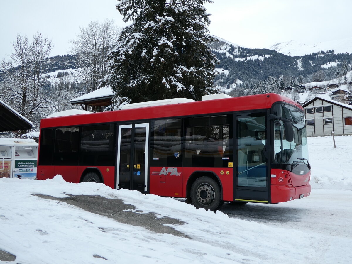 (243'841) - AFA Adelboden - Nr. 59/BE 645'415 - Scania/Hess am 13. Dezember 2022 beim Bahnhof Lenk