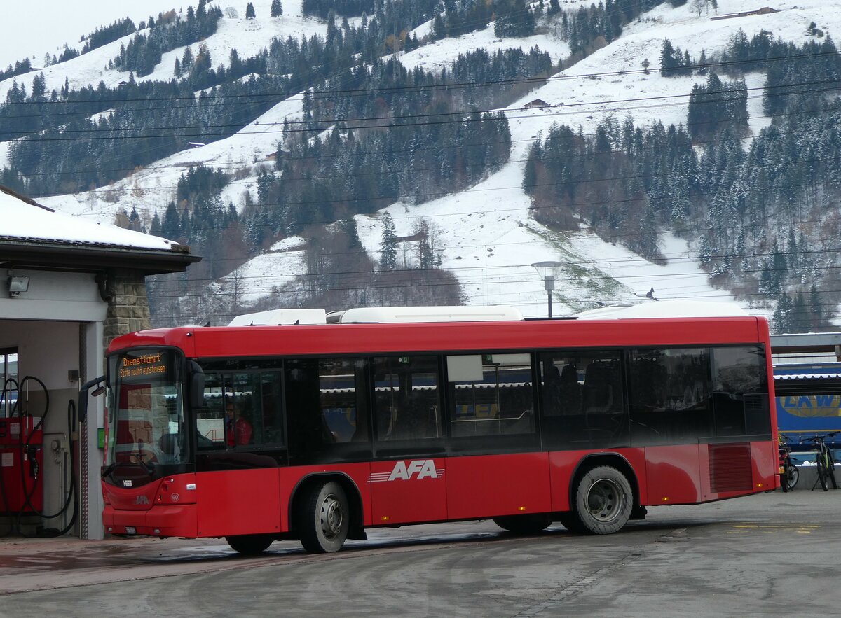 (257'244) - AFA Adelboden - Nr. 50/BE 715'002 - Scania/Hess am 27. November 2023 beim Bahnhof Frutigen