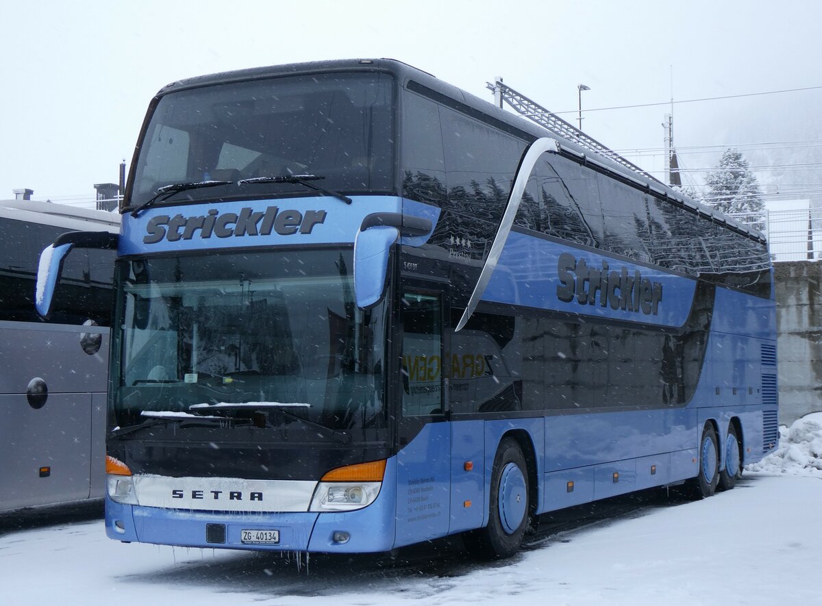 (259'534) - Strickler, Neuheim - Nr. 2/ZG 40'134 - Setra am 23. Februar 2024 in Andermatt, Bahnhofplatz