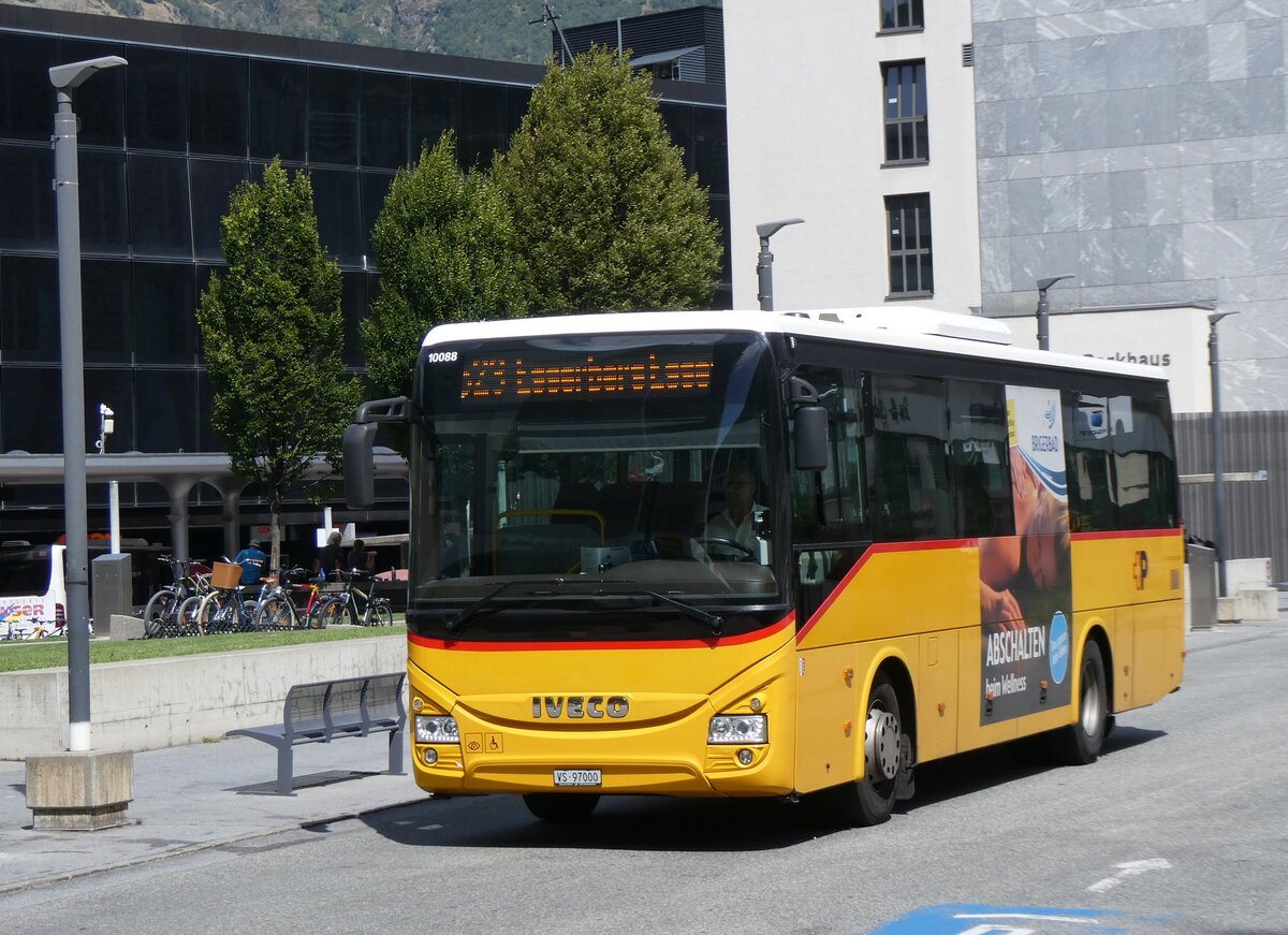 (265'504) - BUS-trans, Visp - VS 97'000/PID 10'088 - Iveco am 8. August 2024 beim Bahnhof Visp