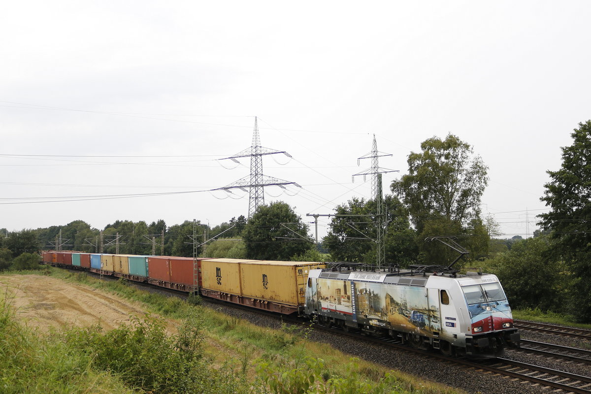 386 020-2 die  150 Jahre Hafenbahn  von Metrans mit einem Containerzug am 17. August 2017 bei Langwedel.