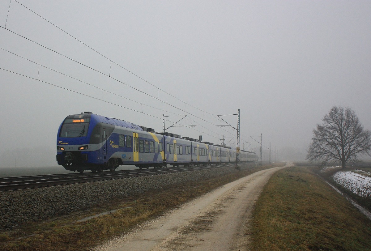 ET 311 am 2. Februar 2014 aus den Nebel kommend bei bersee am Chiemsee.