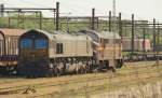 Auch Gegenlicht ist manchmal gut zu nutzen....CFL 266 032 und Mx 1023 in Padborg, sowie die 185 324 die mit ihrem Mischer auf  grn  wartet. Padborg 5.6.11