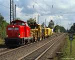 212 034-3 dieselt am 4.9.10 gemtlich mit einem Bauzug durch Tostedt gen Bremen.