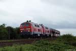 Kurz vor einem kleinen leichten Regenschauer poltern 218 341-6 und ihre Schwester 218 344-0 mit ihrem Syltshuttle auf die Insel am Fuzzi vorbei. Morsum, den 13.7.10