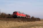 Mit dem Syltshuttle nach Westerland (Sylt) rollen 218 322-6 und 218 314-3 am 2.4.11 durch die Kurve an der Morsumer Nssespitze.