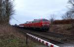 Mit einem Syltshuttle nach Niebll passieren 218 342-4 und eine unbekannte Schwester den B am Bf. in Morsum. 3.4.10
