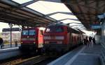 DB Regio Kiel 1218 333-3 mit dem RB75/RB-D 21260 und 6112 172-2 mit dem RE7 nach Flensburg im Bhf Rendsburg. 08.03.2015(857)