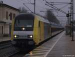 ER 20-001 rauscht am 6.2.11 mit der NOB nach Westerland (Sylt) durch den Bhf. Pinneberg.