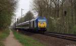 DE2000-02 der NOB dieselt am 16.4.11 mit der NOB nach Westerland (Sylt) durch den Ort Prisdorf weiter gen Nordseekste.