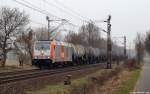 246 010-3 der hvle fhrt am 17.3.12 bei Drverden mit einem Kesselwagenzug durch die Landschaft.