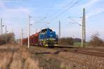 V 2304 (277 404-0) evb Logistik mit einem Holzzug in Demker und fuhr in Richtung Magdeburg weiter. 20.03.2014 