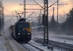 EG 3102 mit einem Mischer und VT 309 der NOB  verlassen  Schleswig. 3.12.1010