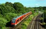 Als RE 21624 aus Lübeck rollen 648 348/848+451/951+463/963 am 23.6.14 die letzten Meter vor dem Ziel durch die Abendsonne.