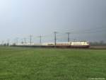 103 235-8 fhrt am 22.4.12 bei leichtem Regen mit dem IC 2417 nach Kln Hbf. kurz vor Neumnster durch die Felder und Wiesen.