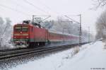112 172-2 fhrt am 20.12.10 mit dem RE 21067 nach Hamburg Hbf. durch den Ort Prisdorf.