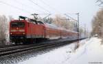 112 154-0 fhrt am 20.12.10 mit dem RE 21019 nach Hamburg Hbf. durch den Prisdorfer Wald.