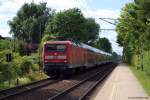 Mit dem RE nach Hamburg Hbf. am Haken rauscht 112 180-5 am 26.6.10 durch den Bhf. Prisdorf.