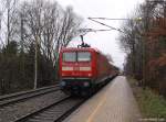 112 141-7 schiebt am 6.2.11 die RB nach Itzehoe aus dem Bhf. Prisdorf heraus.