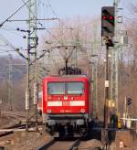 112 144-1 schiebt hier den SH Express nach Flensburg aus dem Schleswiger Bahnhof raus. 20.3.11