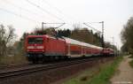 112 180-5 rast am 16.4.11 mit dem RE 21023 nach Hamburg Hbf. durch das Drfchen Prisdorf dem nchsten Halt in Pinneberg entgegen.