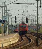 112 176 mit dem SHE von Flensburg nachn Hamburg hier bei der Einfahrt in den Bhf. Neumnster. 21.4.11