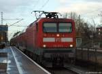 112 177-1 fhrt am 21.12.11 mit RE nach Hamburg Hbf. durch den Bhf. Tornesch.