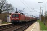 112 151-6 fhrt am 31.3.12 mit dem RE nach Lbeck-Travemnde Strand durch Kupfermhle. Nchster Halt ist Bad Oldesloe.