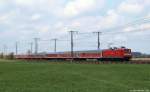112 176-3 zieht am 22.4.12 den SH-Express bei Neumnster durch die Landschaft.