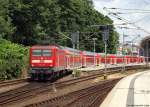 112 143-3 verlsst am 23.6.12 mit dem RE nach Hamburg Hbf. den Kieler Hbf. von Gleis 6. Nchster Halt ist Bordesholm.